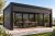 Pergola med justerbar sidomarkis som skyddar mot vind